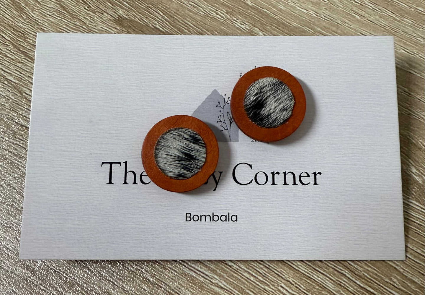 Stud earrings W/cowhide